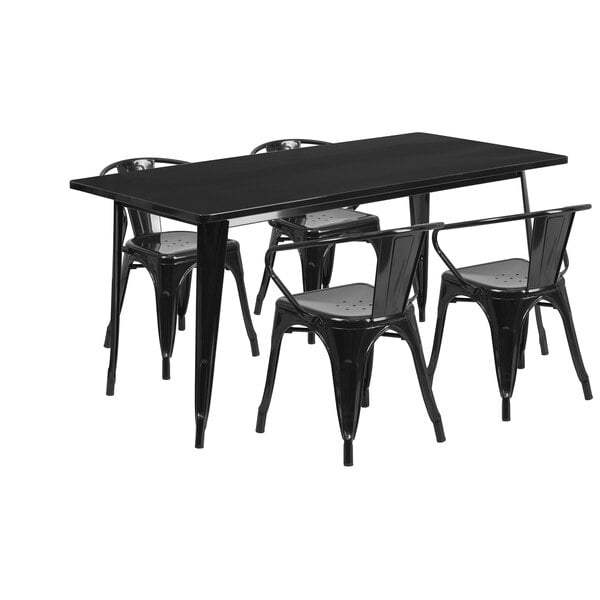 A black metal rectangular table with four black metal chairs.