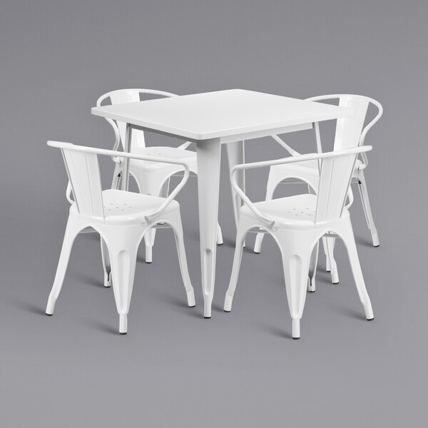 A white Flash Furniture square metal dining table with 4 white arm chairs.