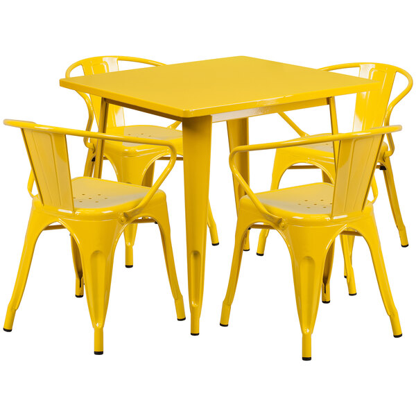 a yellow table with white legs