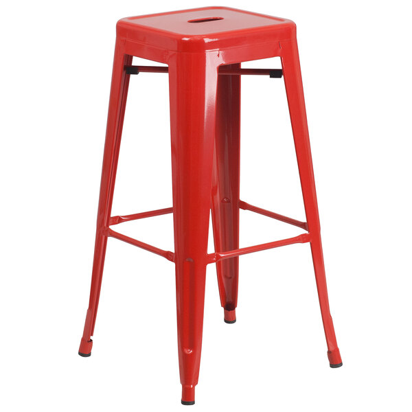 A red metal Flash Furniture bar height table with 4 square seat backless stools.