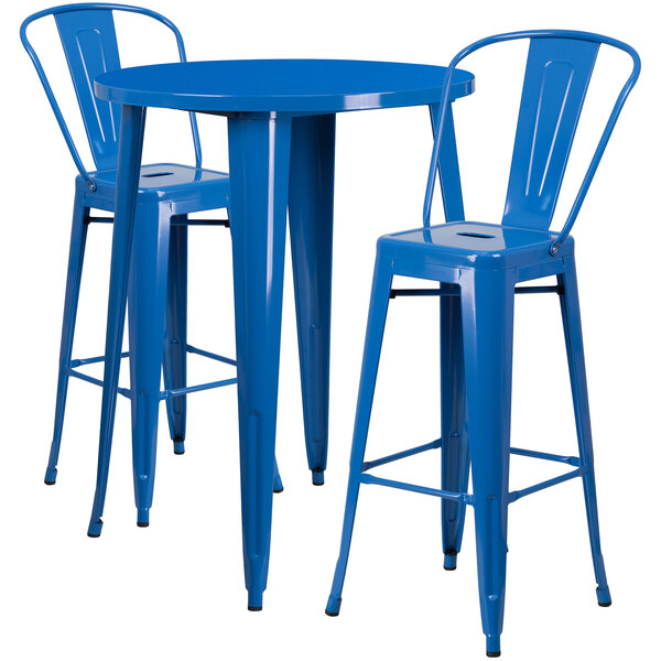 A blue metal round bar table with two blue metal chairs.