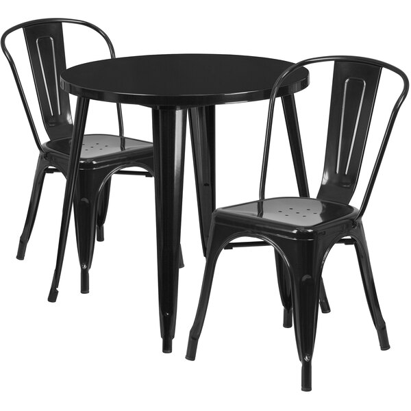 A Flash Furniture black metal table with 2 black metal cafe chairs.