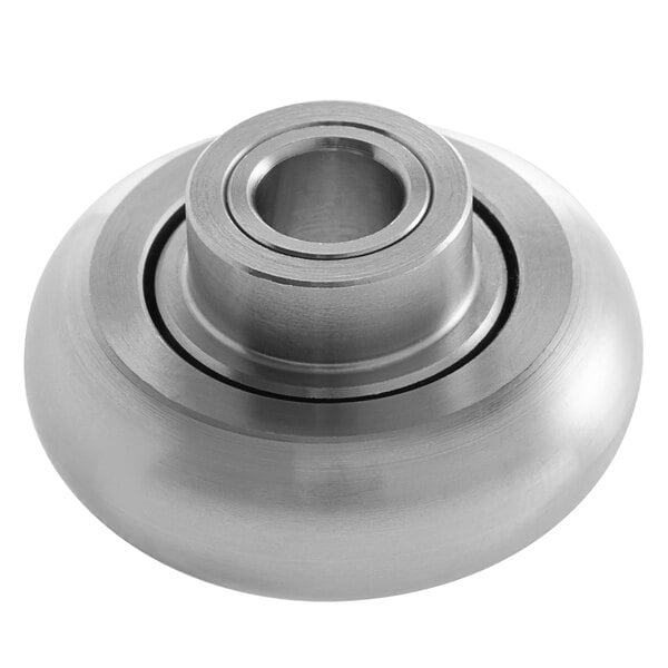 A round metal ServIt bearing slide with a hole and metal ring.