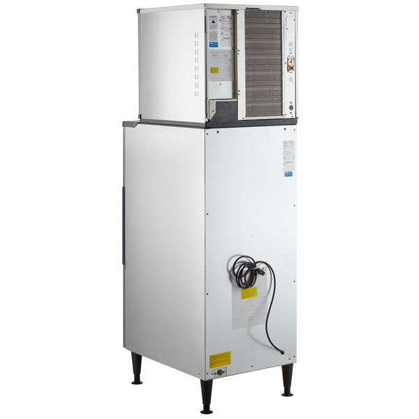 A white and black Scotsman air cooled ice machine with a rectangular shape.