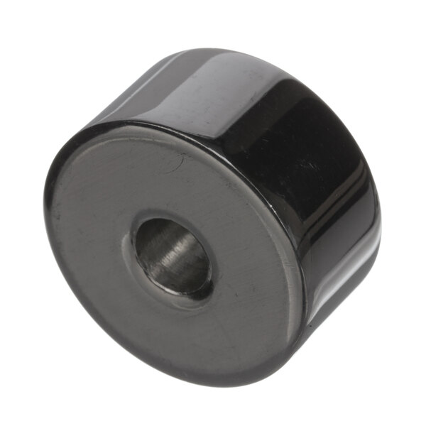 A black round spacer with a hole.