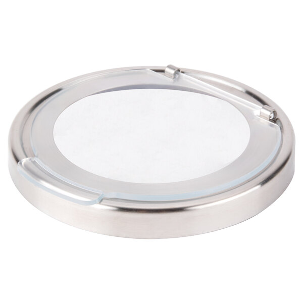 A round silver object with a white circle lid.