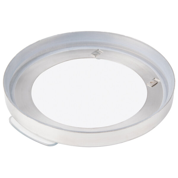 A round white metal plate with a white circle in the center.