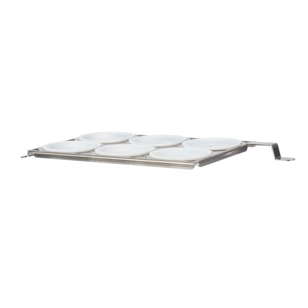 a group of white plates on a metal tray