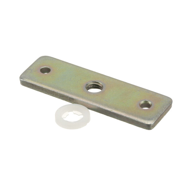 A metal plate with holes and a white plastic ring.