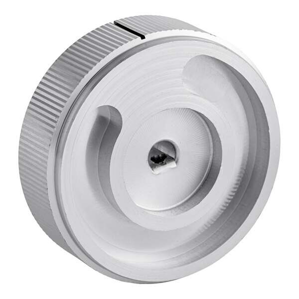 A metallic, circular knob with a textured edge and a central screw hole, featuring a recessed spiral groove on its face.