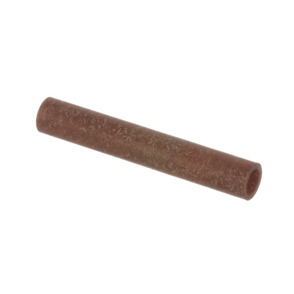 A brown tube with a long handle.