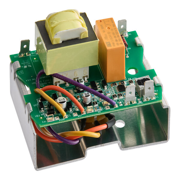 An electronic circuit board with various components, including a transformer, relay, wires, and mounted on a metal bracket.