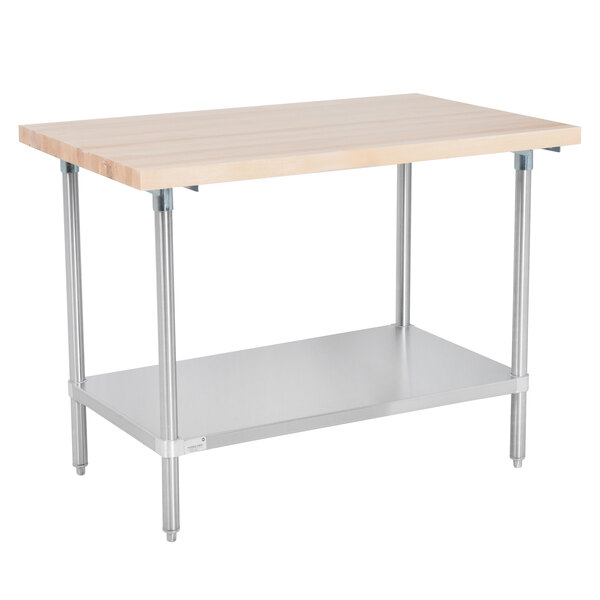 An Advance Tabco wood top work table with a stainless steel base and undershelf.