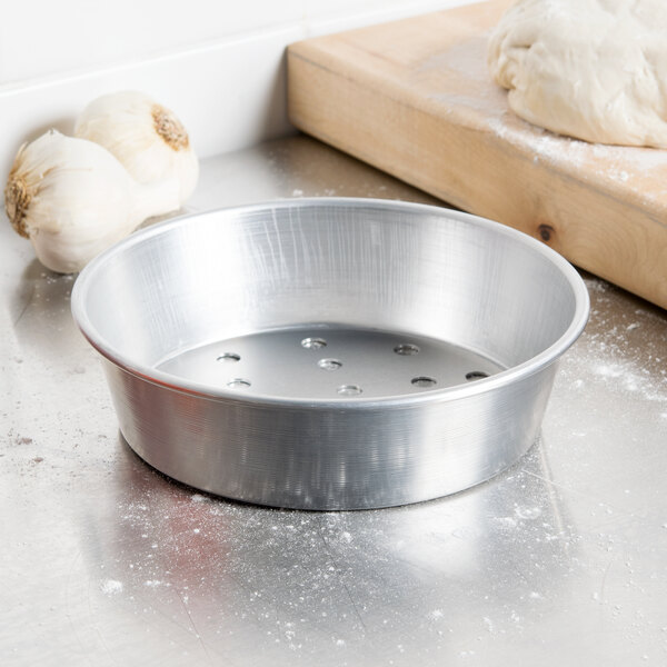 a metal bowl on a counter