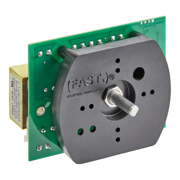 A close-up view of an electronic control component with a circuit board and a protruding metal shaft.