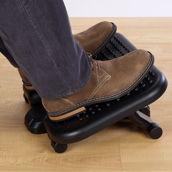 A pair of feet on a Kensington SoleMassage footrest