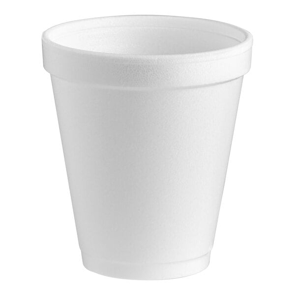 A close-up of a white Dart styrofoam cup.