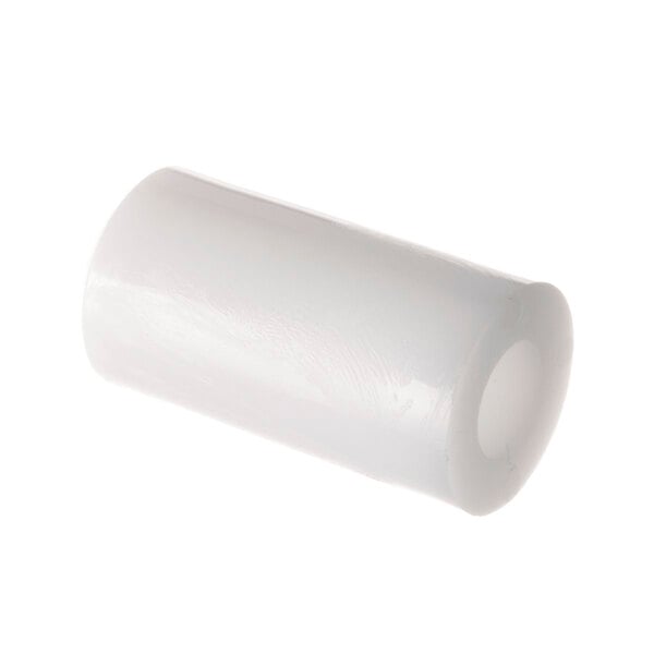 A white cylindrical object with a hole.