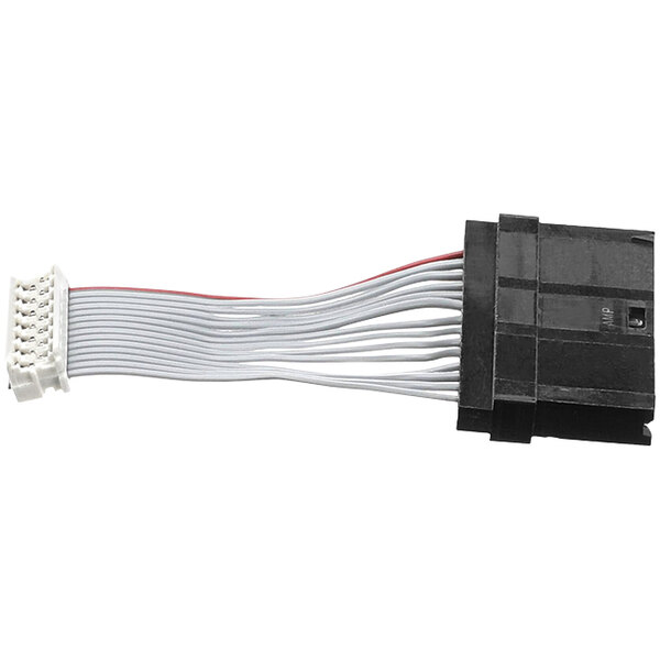 A black and white electrical connector with white and red wires on a Cornelius keypad wiring harness.