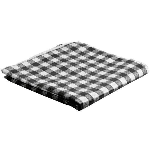 A folded black and white checkered table cover.