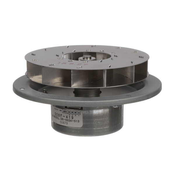 A round metal disc with a hole in the center.