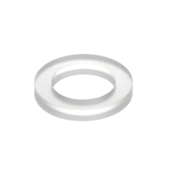 A close-up of a clear plastic gasket with a white circle and a hole in the middle.