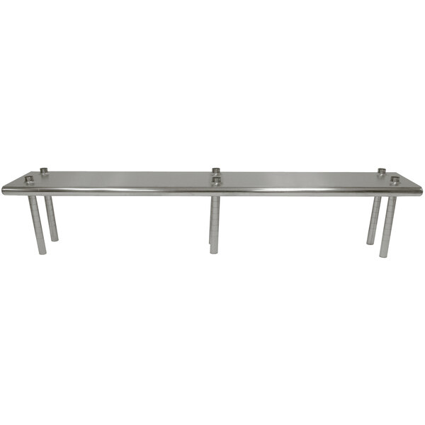 A stainless steel table mounted shelving unit above a long metal table.