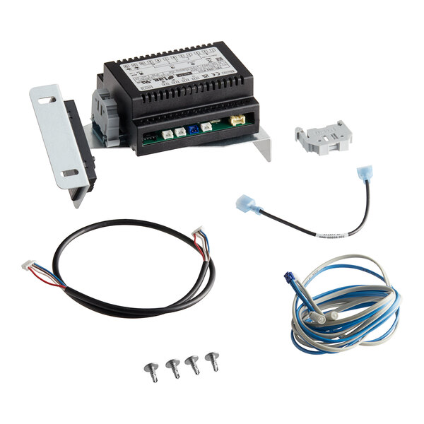 A Traulsen Danfoss to Trl retrofit kit with a black electronic device with wires and screws.