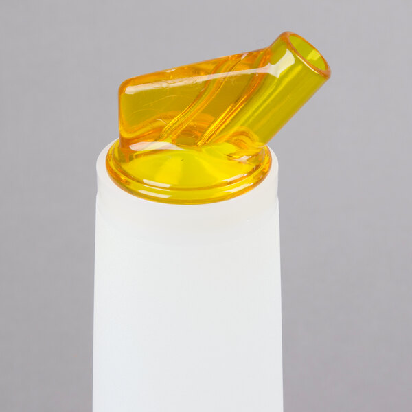 A yellow plastic Carlisle Store 'N Pour container with a white cap and yellow spout.