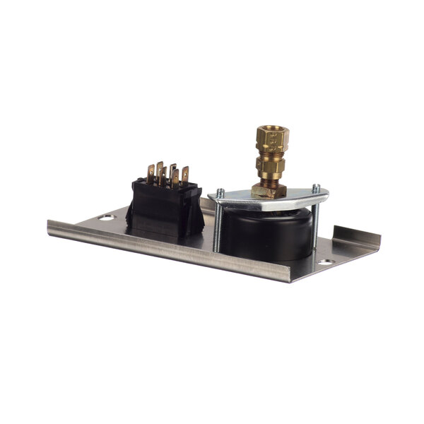 A metal plate with a black object and gold and black connectors.