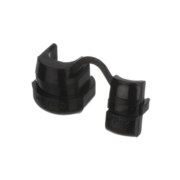 A close-up of a black plastic strain relief clip.
