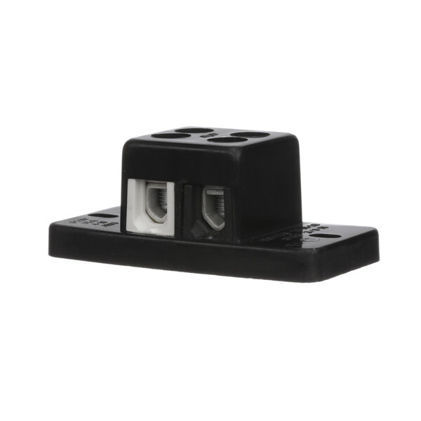 A black rectangular Southern Pride terminal block with white plugs.