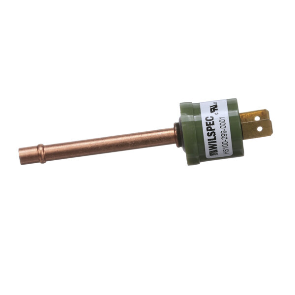 A green and copper pressure switch with a white label.