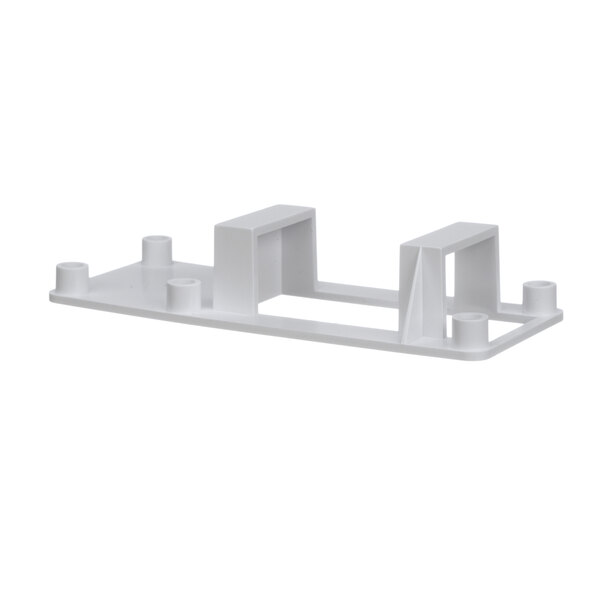 A white plastic Scotsman sensor holder with two holes.