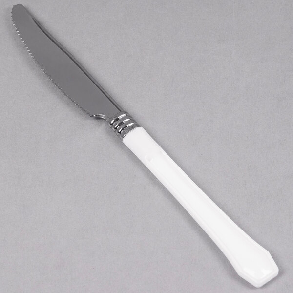 A silver knife with a white handle.