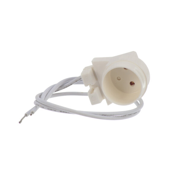 A close-up of a white Kelvinator lamp socket plug with wires.