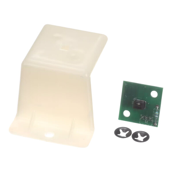 A white plastic container with a green and black circuit board inside and a hole in it.