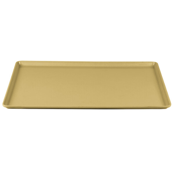 A rectangular tan Cambro dietary tray with a gold finish.
