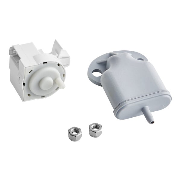 A white plastic device with a white knob and a grey screw.