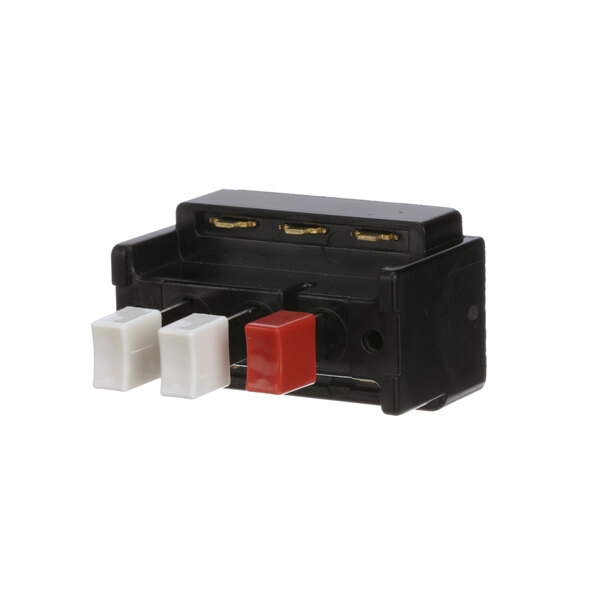 A black box with red and white buttons.