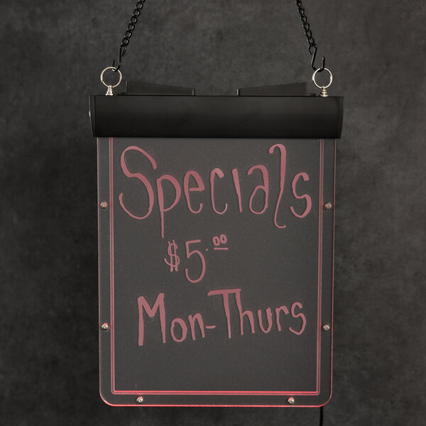 A white Aarco lighted write-on menu board with black lettering hanging from a chain.