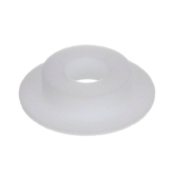 A white plastic round object with a hole in it.