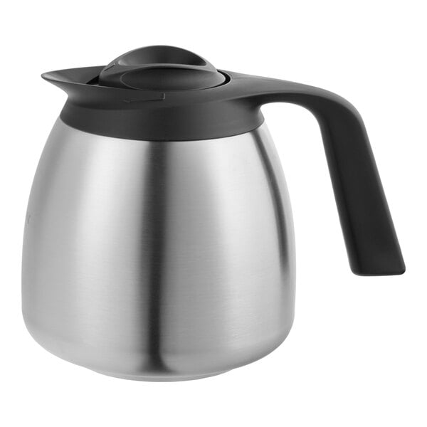 A stainless steel thermal carafe with a black handle and lid.