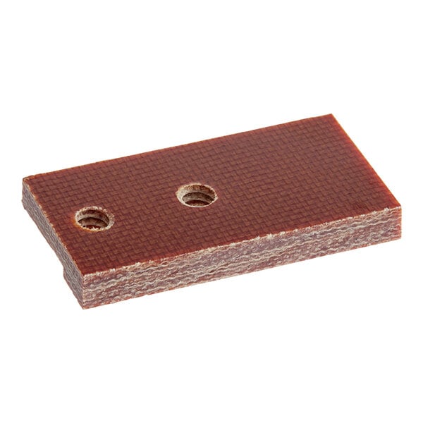 A brown rectangular wood piece with holes.