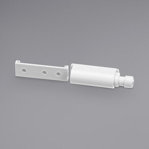 A white plastic push-latch for a Carpigiani Ma-Co soft serve machine.