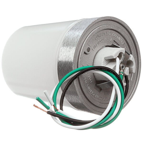 A round white cylinder with green and white wires.