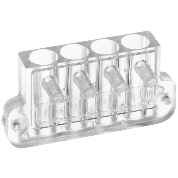 A clear plastic block with four holes for syrup bottles.