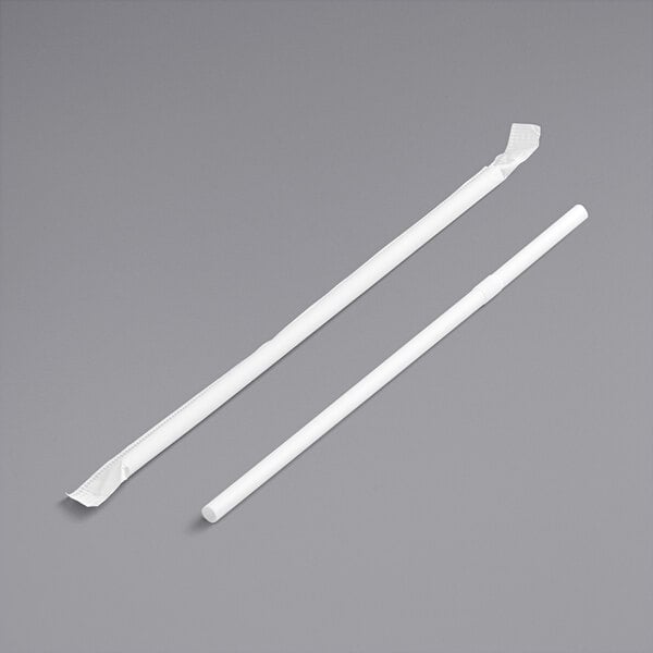 Two white Choice jumbo flex straws on a gray surface.