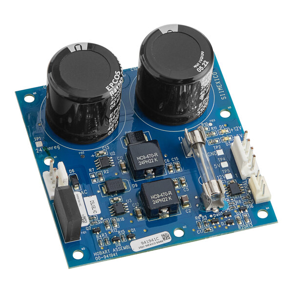 A Hobart power supply board with black computer chips.