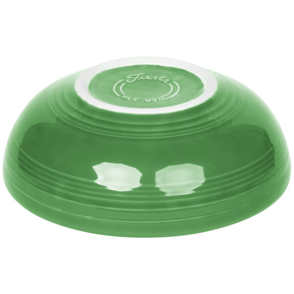 A green bowl with a white rim.